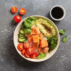 Healthy vegan food concept Poke bowl with salmon, avocado, vegetables and chia seeds