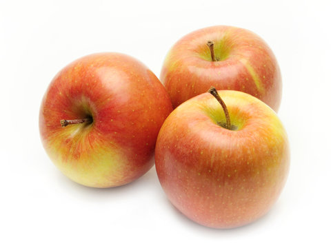 Ripe apples on a white background