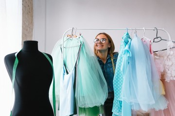 Fashion designer working on her designs in the studio