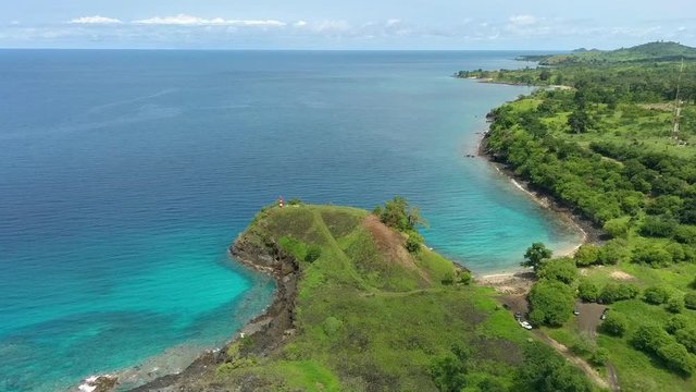 Aerial descend view tropical Blue lagoon beach, São Tomé Island