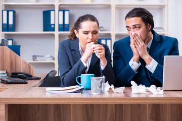 Two employees suffering at workplace