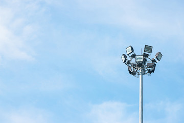 Lighting pole in the park, big one can shine light around it at night to brighter against blue sky