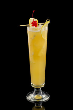 Vertical image of  screwdriver cocktail with orange juice and vodka decorated with cherry isolated at black background.