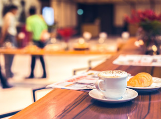 Cup of coffee on the table in the morning.