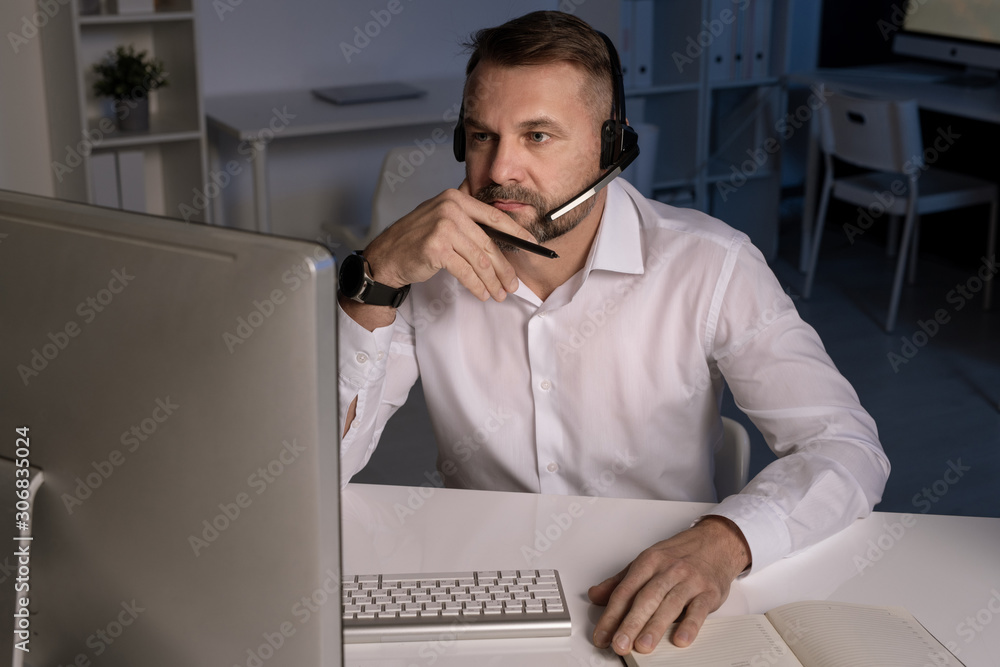 Aufkleber Serious customer support representative concentrating on question of client