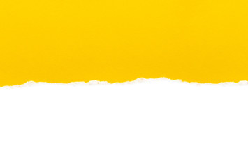 White paper with torn edges isolated with a bright yellow color paper background inside. Good paper texture