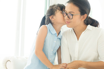 Happy loving family. Mother and her daughter child girl playing and hugging.