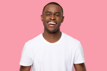 Head shot portrait smiling African American man looking at camera