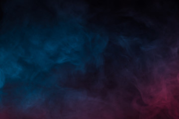 Fototapeta na wymiar Colorful smoke close-up on a black background