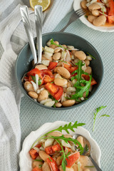 Ready to eat beans salad, healthy protein rich meal with fresh arugula leaves