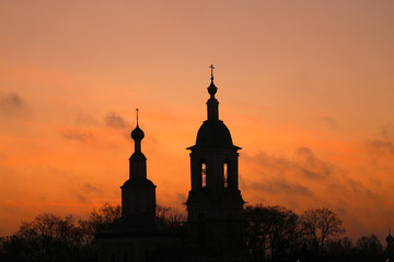 Bright photo dawn with clouds with a Church