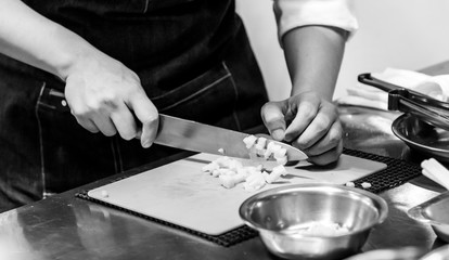 Chef cuts the vegetables cooking in a kitchen, hands slicing vegetables, preparing vegetables