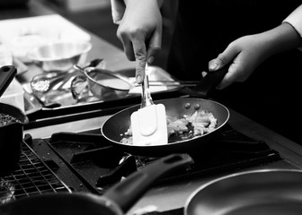 Chef cooking in a kitchen, chef at work, Black & White.