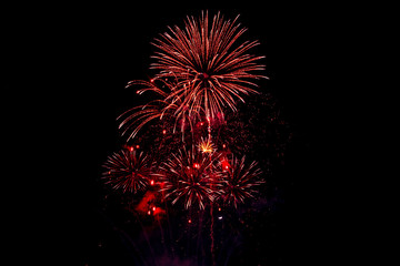 Red fireworks on black background for winter and new year festivals