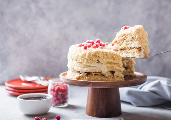 Birthday  creamy layer cake napoleon or chopped cake.  Confectioner decorated with berries on a baking sheet, delicious sweetness. The concept of homemade pastry, cooking pie.