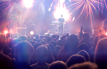 Obraz na płótnie Canvas Fireworks and crowd celebrating the New Year