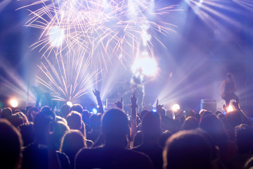 Fototapeta na wymiar Fireworks and crowd celebrating the New Year