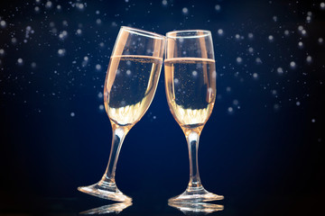 Two champagne glasses ready to bring in the New Year
