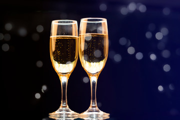 Two champagne glasses ready to bring in the New Year