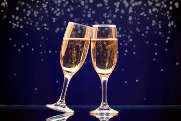 Two champagne glasses ready to bring in the New Year