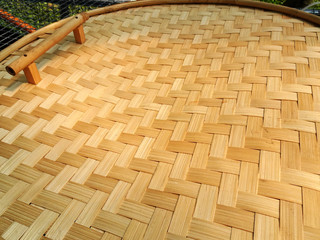 Circle-shaped bamboo woven mat as a trash can cover