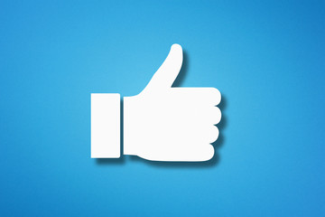 Thumb up like hand symbol on blue background