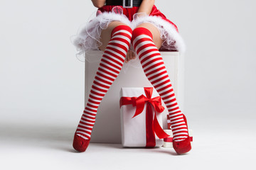 Santa woman legs and christmas gift