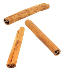 Cinnamon, three sticks soaring, falling, flying isolated on white background with clipping path. Full depth of field. Set of parts.