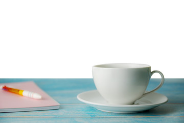 A cup of coffee with notebook on wooden isolated white background