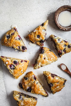 Flat lay of skones with berries and icing. Healthy vegan dessert concept.