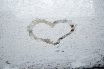 heart love symbol at frozen glass