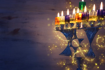 Religion image of jewish holiday Hanukkah background with david star menorah (traditional...