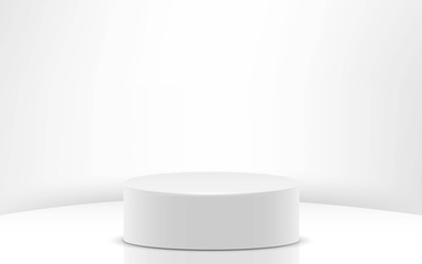 white cylinder in the white studio room