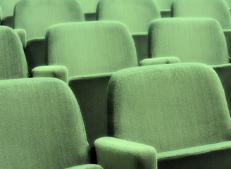 Empty rows of theater or movie seats.