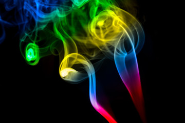 MULTICOLOR SMOKE AGAINST BLACK BACKGROUND