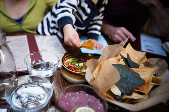 A Family Having Food Together At A Mexican Restaurant. 