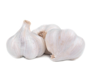 group of three fresh and raw garlic isolated on white background
