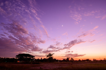 The beautiful colorful sky at sunset, Stars and moon.