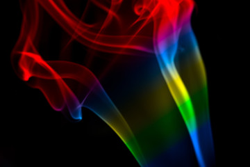 MULTICOLOR SMOKE AGAINST BLACK BACKGROUND