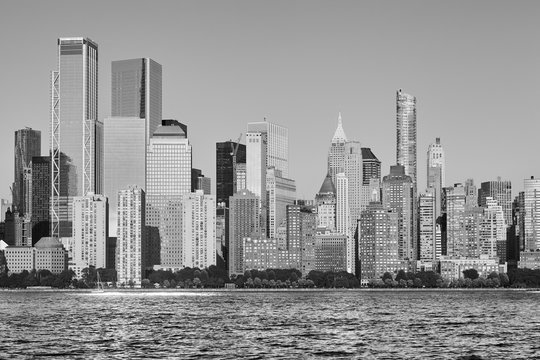 Black and white picture of New York City skyline at sunset, USA.