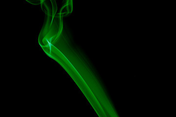 GREEN SMOKE AGAINST BLACK BACKGROUND