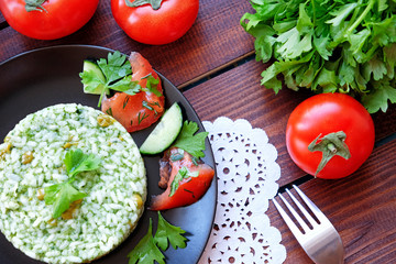 Beautiful vegetarian food. Rice with green peas, parsley, dill and tomatoes.