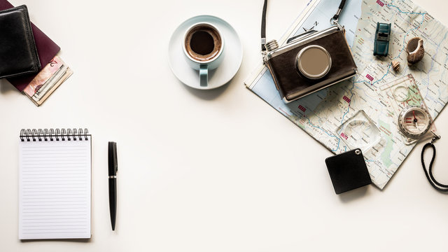 Johannesburg, South Africa - March 31, 2018: Flat Lay Top View vintage Map for planning a trip or vacation with scattered items