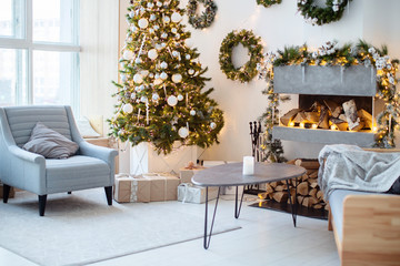 New Year's interior, holiday, Christmas, cozy and warm. Christmas tree and fireplace
