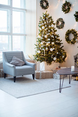 New Year's interior, holiday, Christmas, cozy and warm. Christmas tree and fireplace