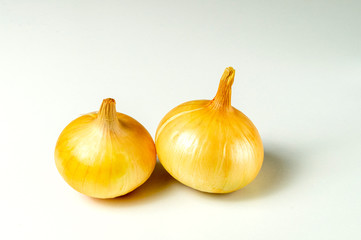 onion on a white background, two bulbs close-up
