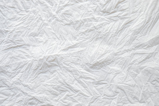 Close-up texture of Crumpled white color tissue paper background abstract. Detail texture of pattern with free space copy for text.