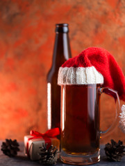 Mug of Christmas beer in Santa hat