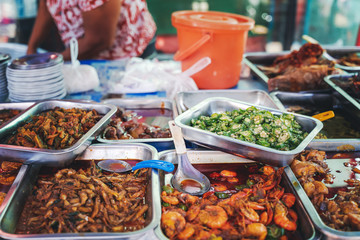 Street counter with food on the street, traditions and cuisine of Southeast Asia