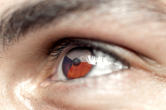 Flag of czeck republic reflects in a man brown eye - election, sport, hope, young, generation	